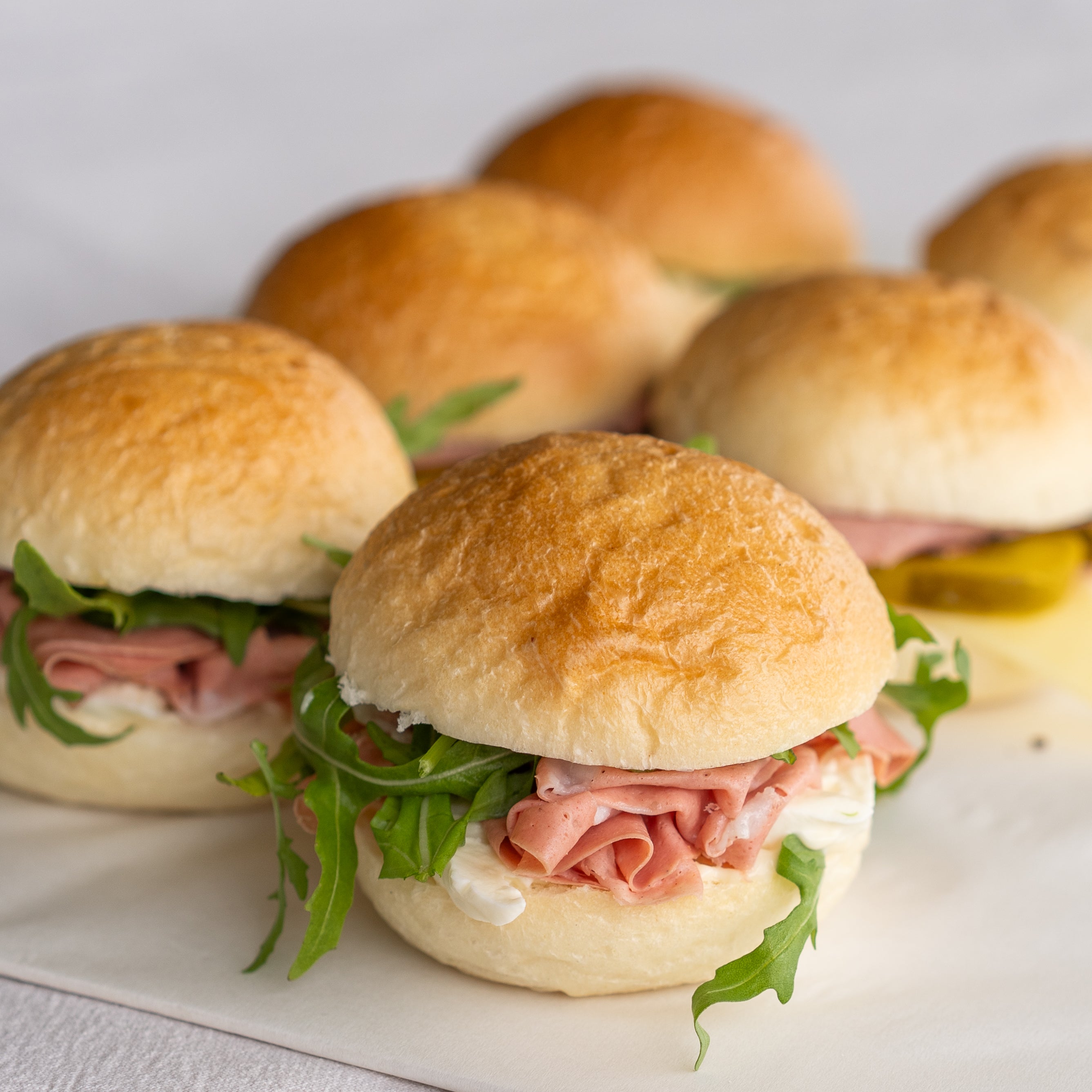 Small sandwiches with ham and lettuce