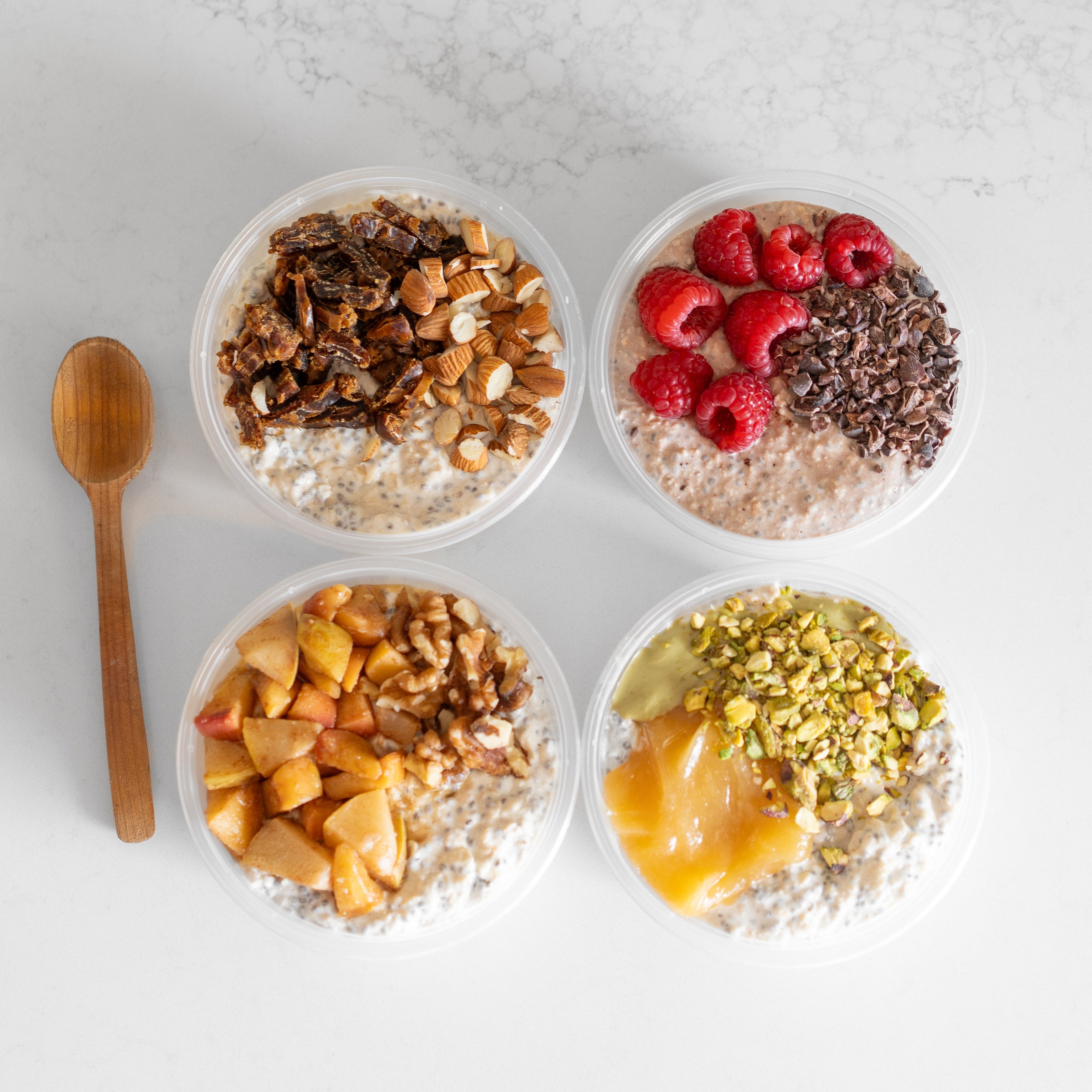 Four bowls of oatmeal with various toppings