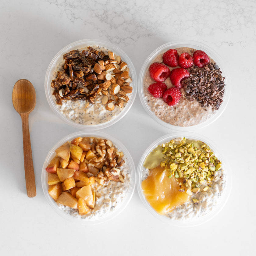 Four bowls of oatmeal with various toppings