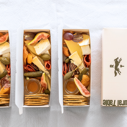 Three small food boxes with assorted grazing